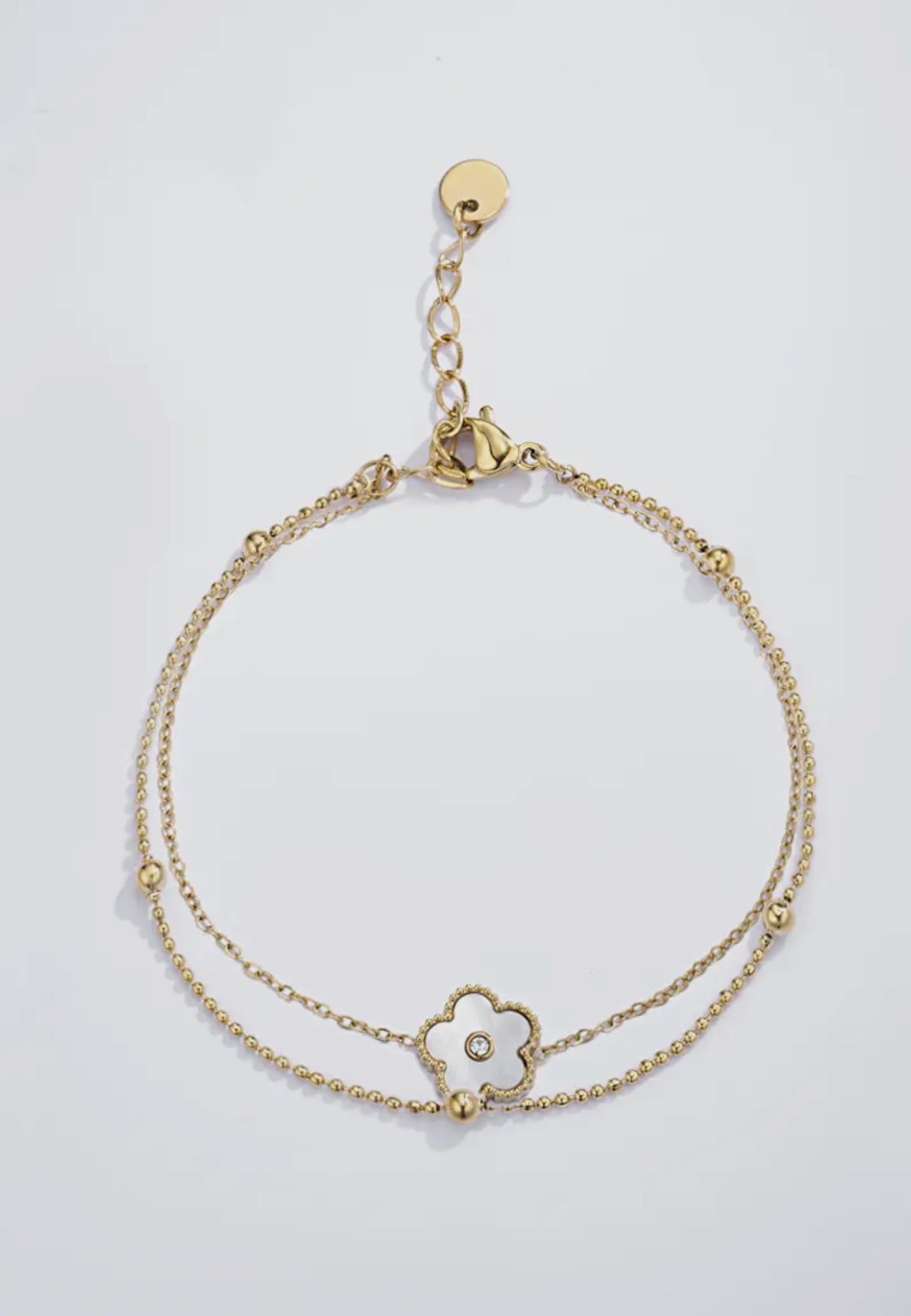 Vergoldetes Damenarmband mit violettem Blumen-Design und Zirkonia-Steinen von Finesse Feminine Jewelry