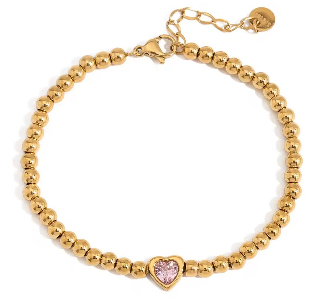 Vergoldetes Damenarmband mit roséfarbenem Herz-Anhänger von Finesse Feminine Jewelry